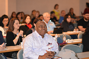 man in audience listens to lecture at 2018 asthma conference