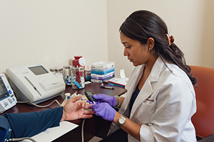 Educator does a blood test